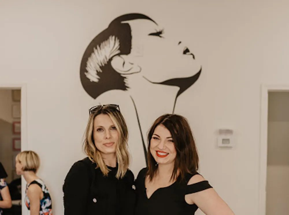 Specialists by the studio mural